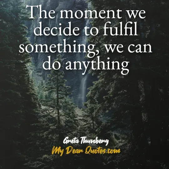 A quote from Greta Thunberg against a dark, misty forest background with a waterfall visible in the distance. The quote reads: "The moment we decide to fulfil something, we can do anything." Below the quote, it says "Greta Thunberg" and "My Dear Quotes.com".
