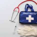 First aid kit symbolizing the importance of standard first aid, highlighting the empowering impact of life-saving knowledge and skills.