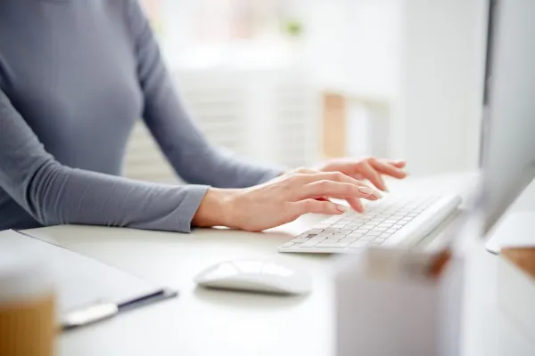 person working on space management software on a laptop