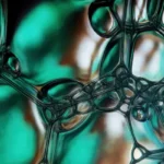 Abstract turquoise image with bubbles representing the mystery of Xovfullmins and the ongoing exploration into its potential effects on health.