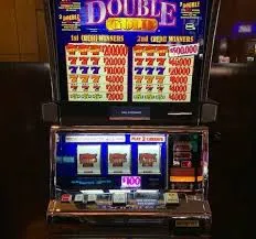Double Gold slot machine showing triple red sevens.