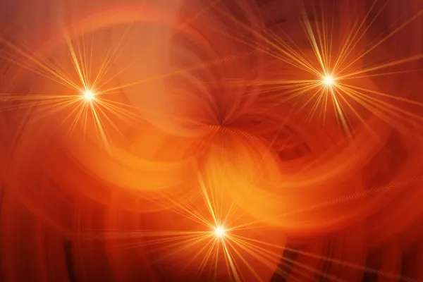 Abstract orange background with three bright, sun-like shapes, symbolizing the search for understanding "What is Hizzaboloufazic?"