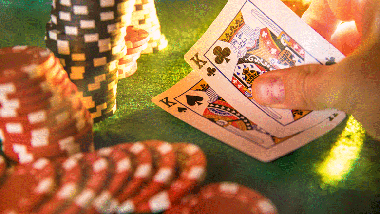 A vintage-style image featuring stacks of poker chips in red, blue, and green, along with scattered playing cards (hearts suit visible) and several red dice. Two overlaid quotes read: "In poker, you are looking at other people's actions in an attempt to decide what cards have." and "If you ain't control the game, control how you play it." The background is a textured, old-fashioned wallpaper.