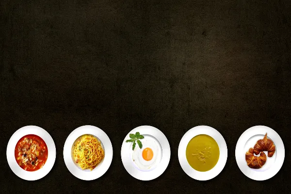 A selection of dishes, including scrambled eggs, showcasing the diverse range of foods that can fit within a food trend like JustALittleBite.