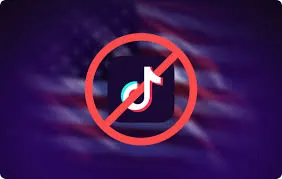 The TikTok logo, a white musical note on a dark background with a red and blue outline, is shown with a red prohibition symbol (a circle with a diagonal line through it) overlaid, set against a blurred background of the American flag.