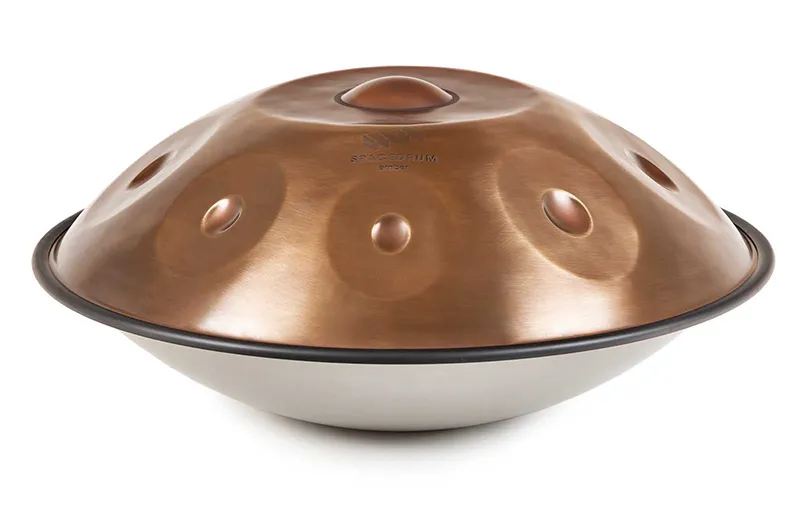 A close-up view of a handpan instrument, showcasing its unique circular indentations.