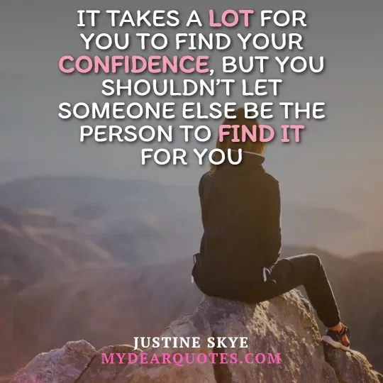 A person sits on a rocky mountain peak, looking out at a vast, hazy landscape of mountains and sky, with their back mostly to the viewer. They are wearing dark clothing. Overlaying the image is the quote "IT TAKES A LOT FOR YOU TO FIND YOUR CONFIDENCE, BUT YOU SHOULDN'T LET SOMEONE ELSE BE THE PERSON TO FIND IT FOR YOU." The words "LOT," "CONFIDENCE," and "FIND IT" are highlighted in pink. The quote is attributed to Justine Skye, with "MYDEARQUOTES.COM" visible below.