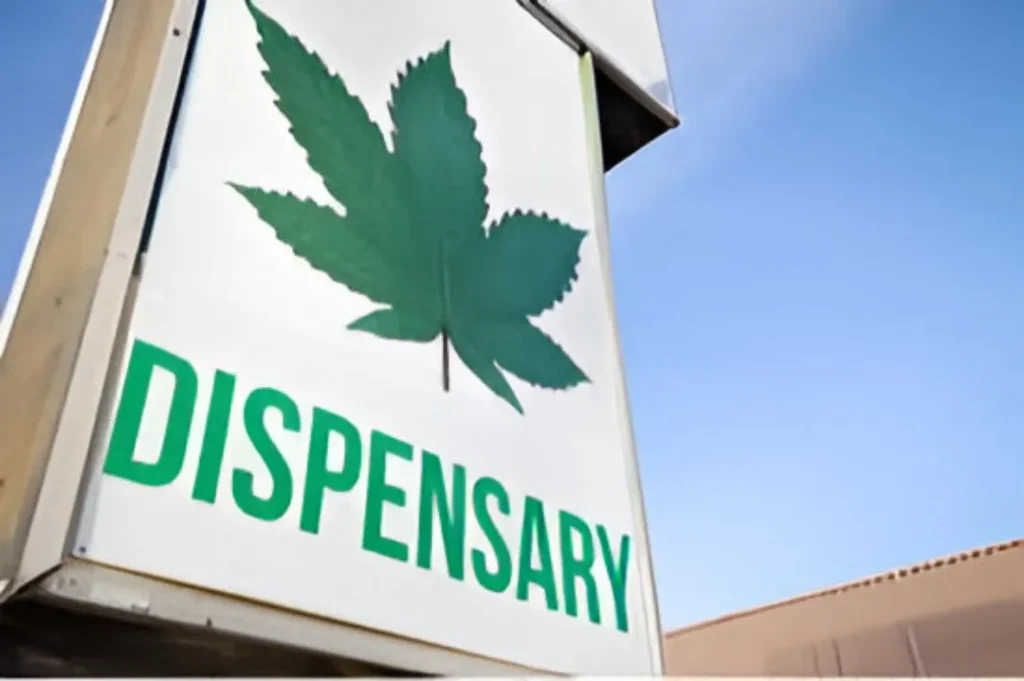 Dispensary sign with a cannabis leaf.