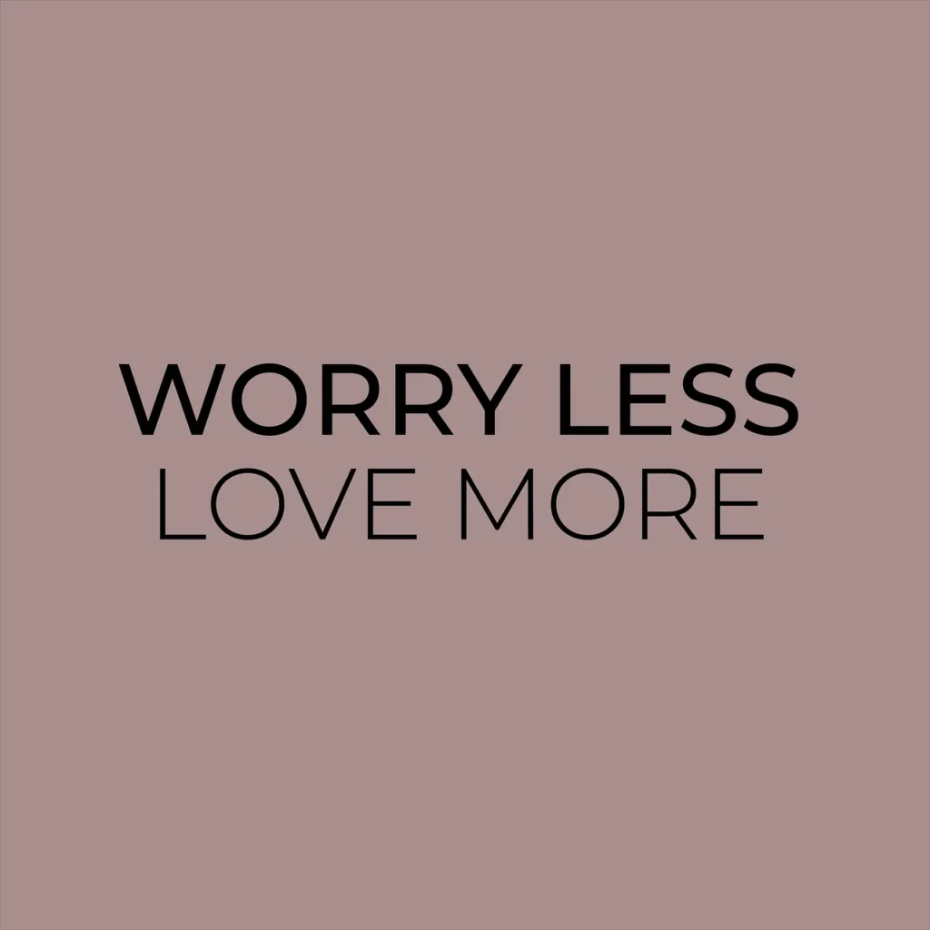 A minimalist graphic with the text "WORRY LESS LOVE MORE" centered in black font on a dusty rose or mauve background.