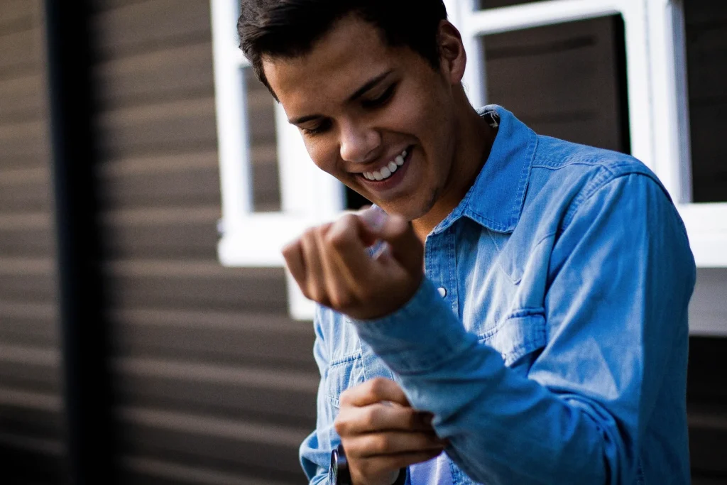 Smiling person representing how appearance influences confidence and first impressions.